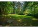 Large, grassy backyard area perfect for outdoor activities and gatherings at 1511 Hatch Rd, Chapel Hill, NC 27516