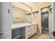 Bathroom featuring a large mirror, ample counter space, and a shower with glass doors at 1511 Hatch Rd, Chapel Hill, NC 27516