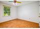 Bedroom featuring hardwood floors, a window, and a ceiling fan at 1511 Hatch Rd, Chapel Hill, NC 27516