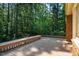 Wide wooden deck overlooking a backyard forest at 1511 Hatch Rd, Chapel Hill, NC 27516