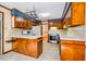 Spacious kitchen with a breakfast bar, wood cabinetry, and modern appliances at 1511 Hatch Rd, Chapel Hill, NC 27516