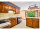 Well-lit kitchen featuring ample wood cabinetry, countertops, and natural light at 1511 Hatch Rd, Chapel Hill, NC 27516