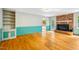 Spacious living room with hardwood floors, brick fireplace, and built-in shelving at 1511 Hatch Rd, Chapel Hill, NC 27516
