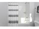This standard bath has a bathtub with a curtain for privacy and neutral decor at 1514 W Knox St, Durham, NC 27705