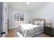 Comfortable bedroom featuring a plush bed, a large window, and a soothing color palette at 1514 W Knox St, Durham, NC 27705
