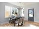Dining area with table set for entertaining and filled with natural light at 1514 W Knox St, Durham, NC 27705
