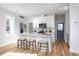 Bright kitchen featuring an island with seating and modern appliances at 1514 W Knox St, Durham, NC 27705