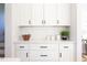 Bright kitchen featuring white cabinets, subway tile backsplash, and modern decor at 1514 W Knox St, Durham, NC 27705
