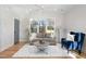 Cozy living room featuring hardwood floors, neutral tones, and abundant natural light at 1514 W Knox St, Durham, NC 27705