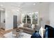 Inviting living room with hardwood floors, neutral tones, and abundant natural light at 1514 W Knox St, Durham, NC 27705