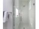 The newly renovated shower has white subway tile and a window for ample lighting at 1514 W Knox St, Durham, NC 27705