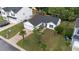Aerial view showcases a well-maintained single-Gathering home with lush green lawn, a driveway, and neighborhood setting at 1725 E Honey Springs Ave, Fuquay Varina, NC 27526