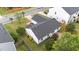 Aerial view showcasing the home's backyard, roof, and landscaping at 1725 E Honey Springs Ave, Fuquay Varina, NC 27526