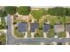 An aerial shot of homes on a street, each with a driveway and landscaped front yard at 1725 E Honey Springs Ave, Fuquay Varina, NC 27526