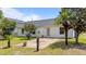 Backyard features a concrete patio and mature landscaping at 1725 E Honey Springs Ave, Fuquay Varina, NC 27526