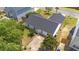 Aerial view of the backyard with a concrete patio area and a well maintained lawn at 1725 E Honey Springs Ave, Fuquay Varina, NC 27526