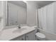 Simple bathroom featuring a vanity, toilet, and bathtub with a shower curtain at 1725 E Honey Springs Ave, Fuquay Varina, NC 27526
