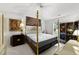 This bedroom features a four poster bed with elaborate gold accents and stylish furnishings at 1725 E Honey Springs Ave, Fuquay Varina, NC 27526