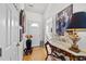 Inviting entryway with hardwood floors, decorative table, and large artwork that accentuates the space at 1725 E Honey Springs Ave, Fuquay Varina, NC 27526