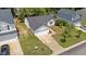 Aerial view showcasing the home's front exterior, garage, and manicured front yard at 1725 E Honey Springs Ave, Fuquay Varina, NC 27526