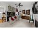 Spacious living room with eclectic decor and a modern ceiling fan at 1725 E Honey Springs Ave, Fuquay Varina, NC 27526