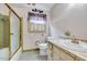 Traditional bathroom featuring wallpaper, a bathtub, and a single-sink vanity at 1732 Farmington Rd, Rocky Mount, NC 27801
