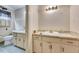 Traditional bathroom featuring wallpaper, a double-sink vanity, and a toilet at 1732 Farmington Rd, Rocky Mount, NC 27801