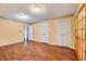 Bedroom with hardwood floors, classic trim, and closet and exterior door access at 1732 Farmington Rd, Rocky Mount, NC 27801