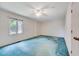 Spacious bedroom featuring a ceiling fan and window offering natural light at 1732 Farmington Rd, Rocky Mount, NC 27801