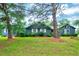Charming single-story home featuring a blue exterior, white shutters, and a well-maintained front lawn at 1732 Farmington Rd, Rocky Mount, NC 27801