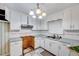 Traditional kitchen featuring white cabinets, blue countertops, and checkered flooring at 1732 Farmington Rd, Rocky Mount, NC 27801