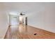 Spacious living room with wood floors, neutral walls, and a ceiling fan at 1732 Farmington Rd, Rocky Mount, NC 27801