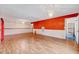 Spacious living room featuring wood-look floors and bright accent walls with a ceiling fan at 1732 Farmington Rd, Rocky Mount, NC 27801