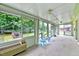 Sun room with all-around view of outside yard at 1732 Farmington Rd, Rocky Mount, NC 27801