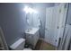 This bathroom features a white vanity, oval mirror, and a neutral color scheme that creates a serene atmosphere at 1806 Stroll Cir, Fuquay Varina, NC 27526
