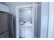 Convenient closet with washer and dryer next to stainless steel refrigerator at 1806 Stroll Cir, Fuquay Varina, NC 27526