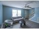 Stylish living room with ample natural light, grey sofa, and modern furniture at 1806 Stroll Cir, Fuquay Varina, NC 27526