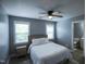 Comfortable main bedroom with natural light, ceiling fan, and ensuite bathroom at 1806 Stroll Cir, Fuquay Varina, NC 27526