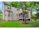 Spacious backyard with a screened porch, outdoor seating area, and mature trees at 201 Forbes Rd, Wake Forest, NC 27587