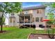Expansive backyard with patio area, screened porch, and well-maintained lawn at 201 Forbes Rd, Wake Forest, NC 27587