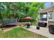 Lush backyard featuring a patio, trampoline, sports net and covered porch, perfect for outdoor living at 201 Forbes Rd, Wake Forest, NC 27587