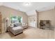 Versatile bonus room with a sectional sofa, natural light, and an adjacent study area at 201 Forbes Rd, Wake Forest, NC 27587