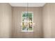Elegant chandelier illuminates the hallway above at 201 Forbes Rd, Wake Forest, NC 27587