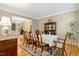 Formal dining room featuring hardwood floors and seating for eight, adjacent to living spaces at 201 Forbes Rd, Wake Forest, NC 27587
