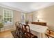 Traditional dining room with large window for ample natural light, with wood flooring at 201 Forbes Rd, Wake Forest, NC 27587