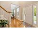 Bright foyer with hardwood floors, staircase, and views into adjacent rooms at 201 Forbes Rd, Wake Forest, NC 27587