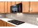 Well-equipped kitchen with granite countertops and stainless steel appliances, subway tile backsplash and stove at 201 Forbes Rd, Wake Forest, NC 27587