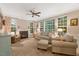Cozy living room with a fireplace, plush seating, and an abundance of natural light at 201 Forbes Rd, Wake Forest, NC 27587