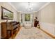 Cozy sitting room features a piano and bay window, creating a charming and bright space at 201 Forbes Rd, Wake Forest, NC 27587
