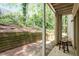 Back patio offers a secluded outdoor space with a view of the surrounding woods at 2010 Quaker Lndg # 102, Raleigh, NC 27603